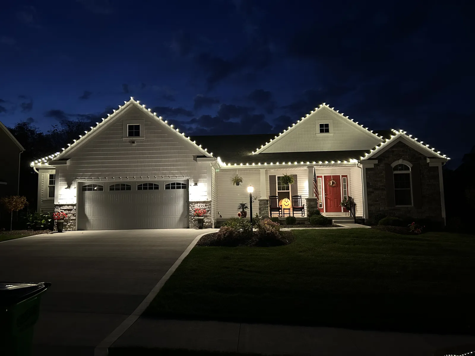 Close-up of red LED bulbs evenly spaced along a roofline