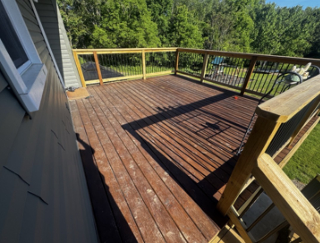 Before — Alex’s deck with the darker original stain